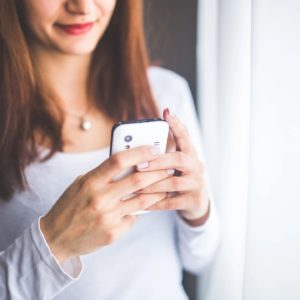 image of a woman on her phone